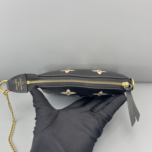 Louis Vuitton Mini Pochette Accessories Empreinte Monogram Giant Calfskin Black White